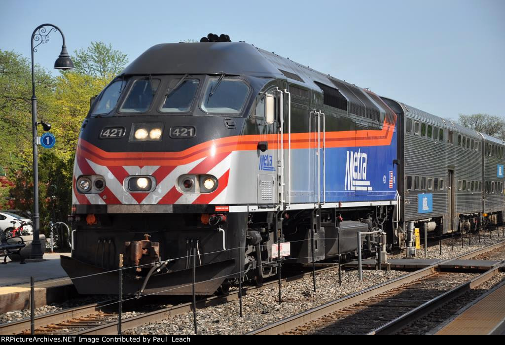 Outbound commuter approaches its station stop